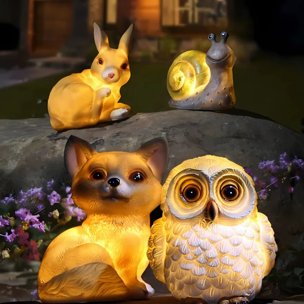 Decorative LED garden lamp with animal motif, solar powered