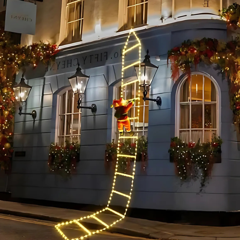 Ciepłe świąteczne lampki z wspinającym się Mikołajem