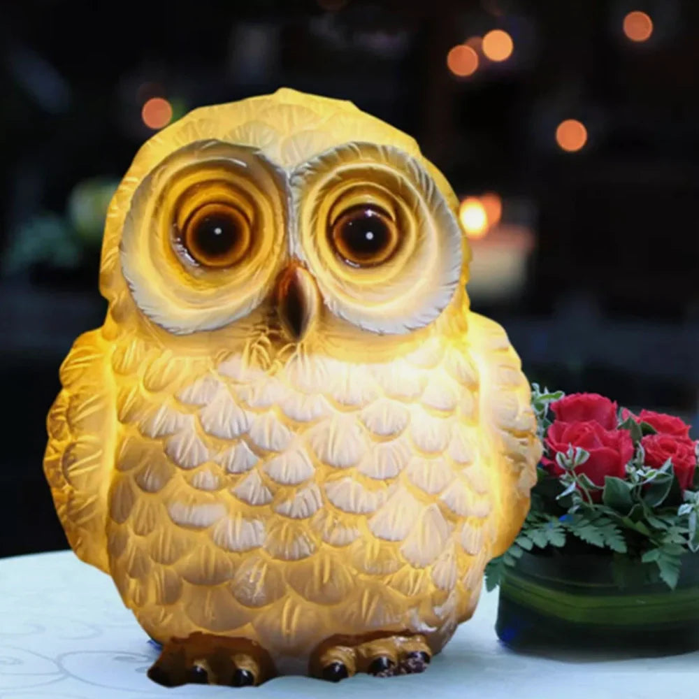 Decorative LED garden lamp with animal motif, solar powered
