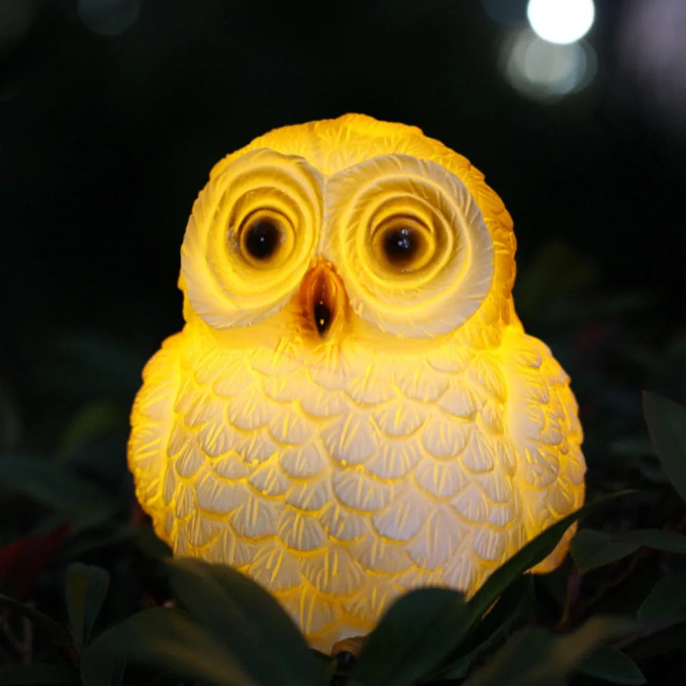 Decorative LED garden lamp with animal motif, solar powered