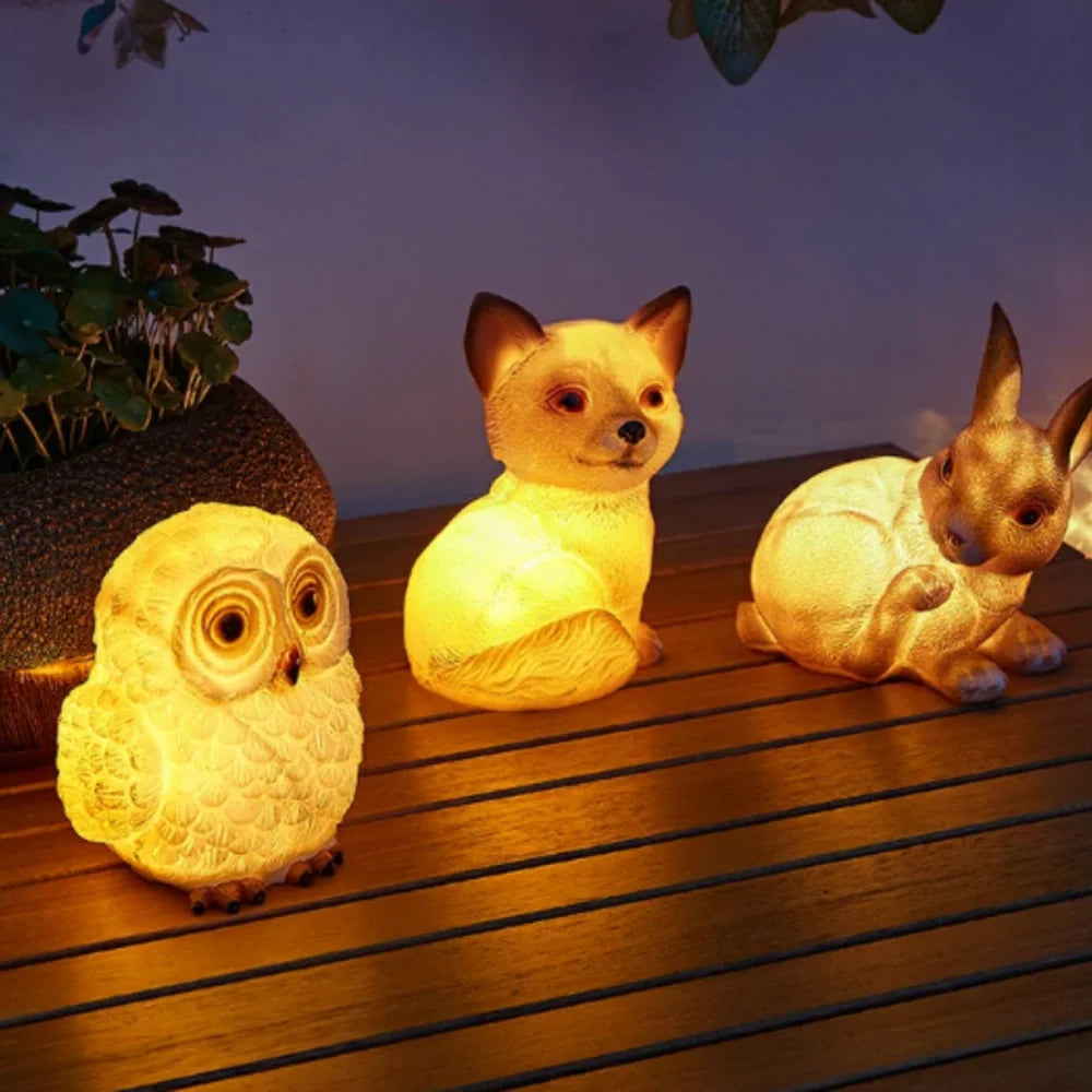 Decorative LED garden lamp with animal motif, solar powered