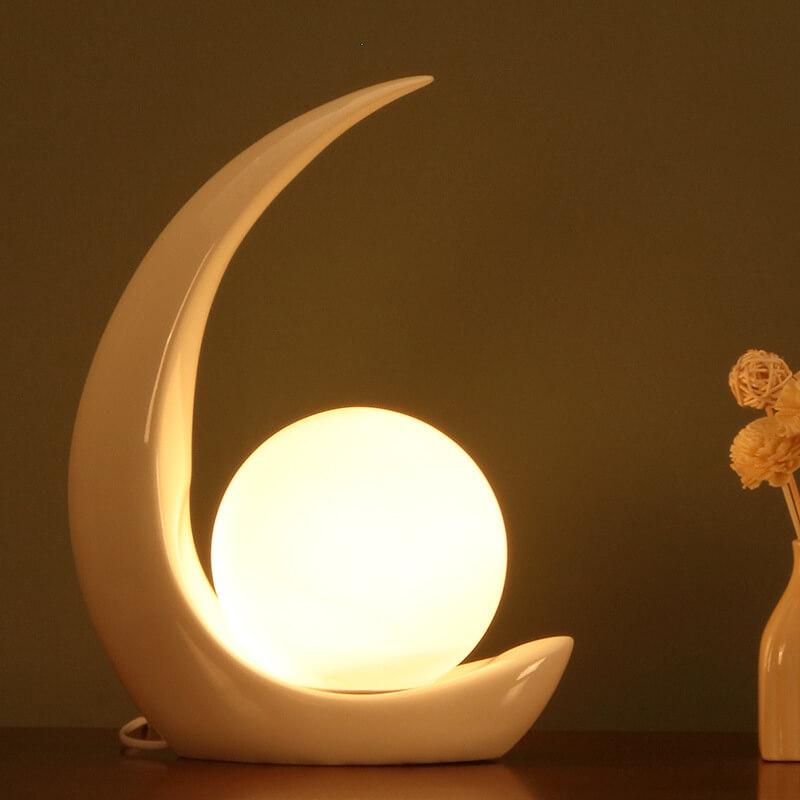 Nowoczesna lampka nocna w kształcie półksiężyca z szklanym kloszem