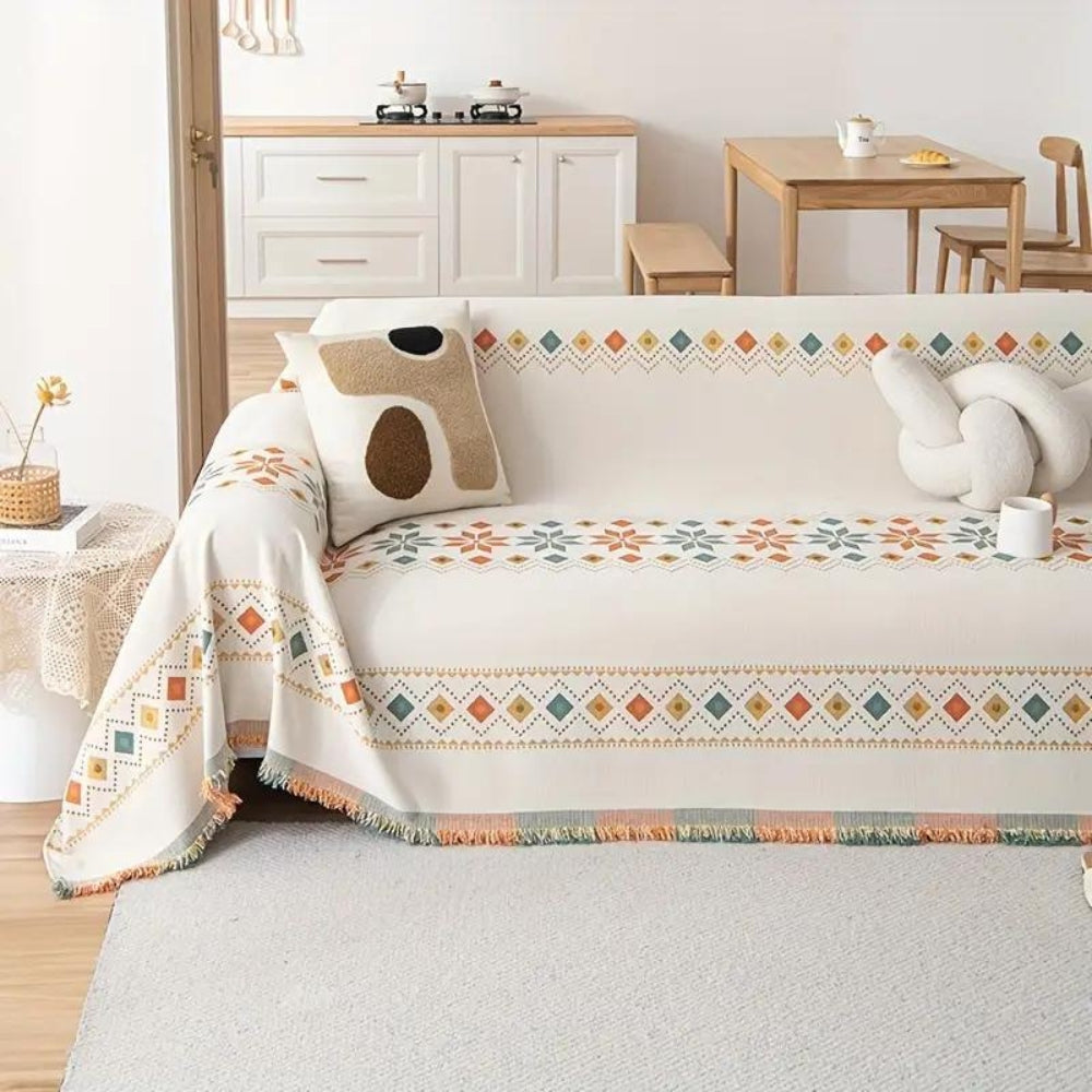 Modny koc z frędzlami w stylu boho na sofę i łóżko