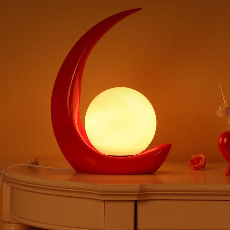 Nowoczesna lampka nocna w kształcie półksiężyca z szklanym kloszem