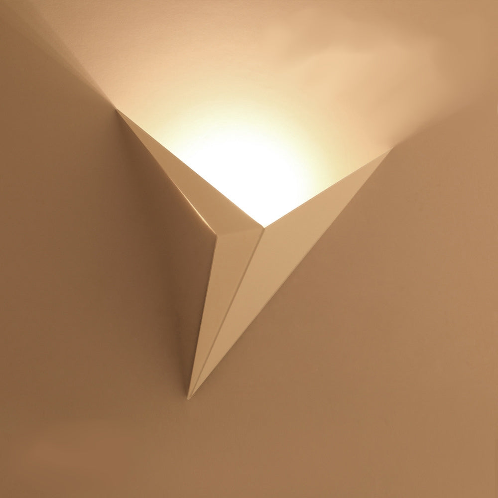 Minimalist wall lamp in the shape of a triangle with the option of warm or cool light